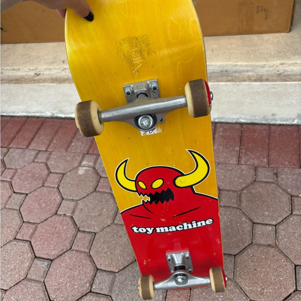 Toy Machine Yellow and Red Skateboard with Graphic